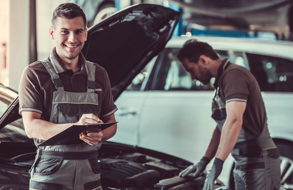 Mechanic looking over a vehicle - MOT Testing Kilmarnock