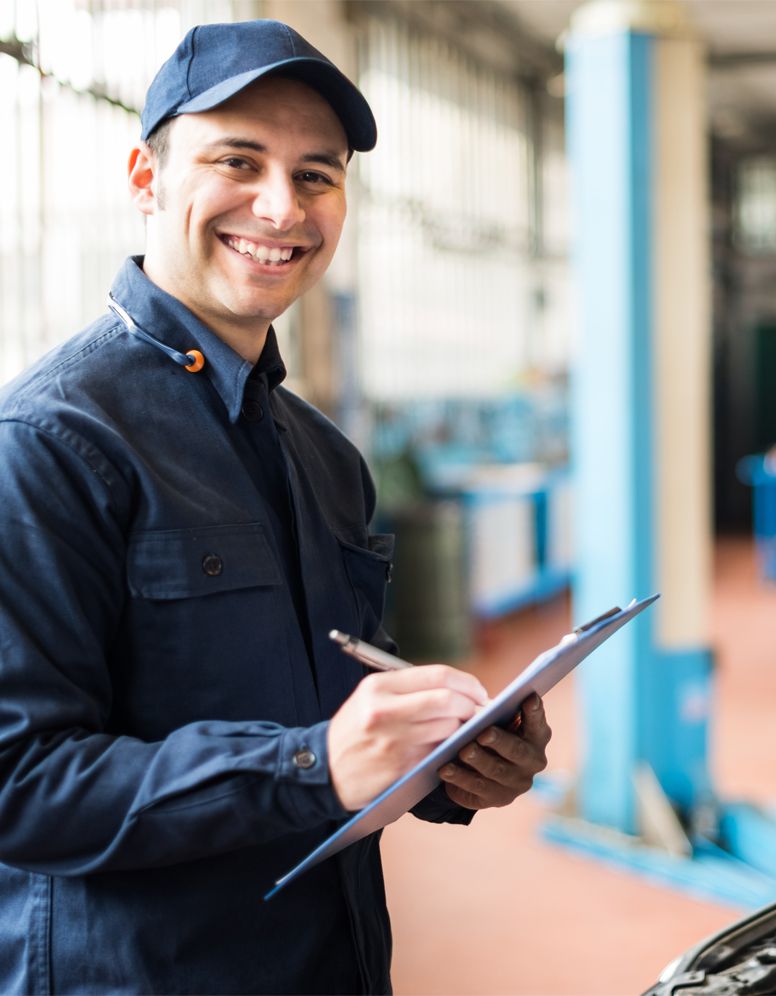 Mechanic checking off his list - Car Servicing Kilmarnock